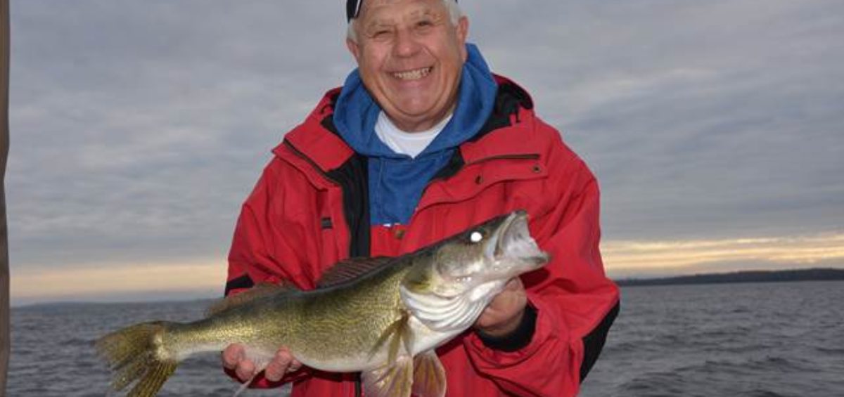 Terry Tuma holding a fish.