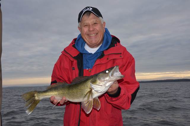 Terry Tuma holding a fish. 